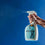 Impact Stain + Odor Remover being sprayed with a blue background