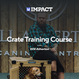 Professional Dog Behaviorist and trainer Will Atherton sitting on top of a tan collapsible dog crate with a yellow lab inside of it.