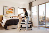 golden retriever jumping up on their human excited about their collapsible dog crate