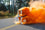 photo of three impact dog crates, high anxiety, stationary, and collapsible dog crate with an orange smoke bomb in all three highlighting the ventilation capabilities on the crates